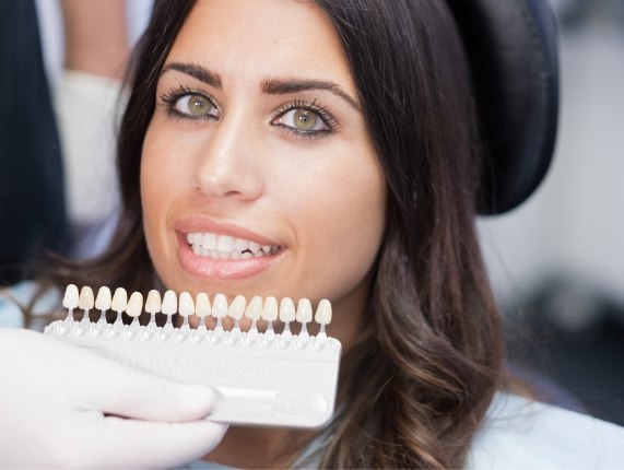 Woman getting dental veneers from her cosmetic dentist in West Orange