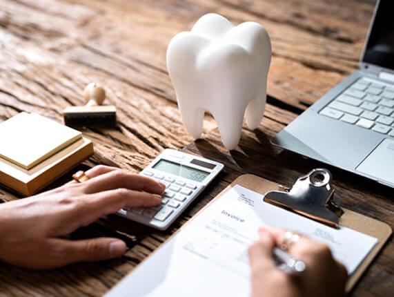 a patient working on a dental insurance form