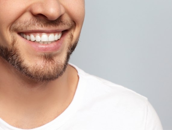 CLose up of smiling man with short beard