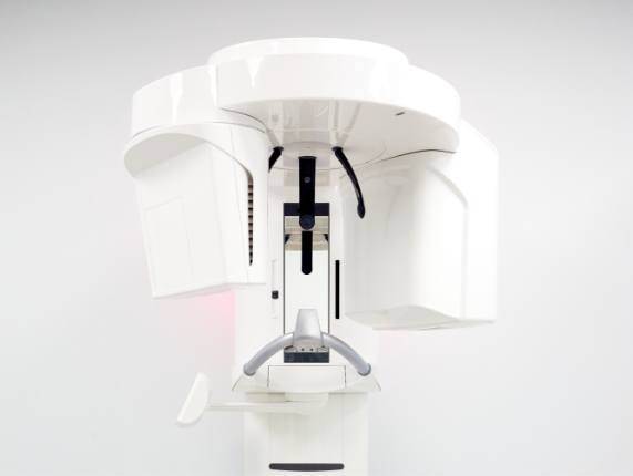 Advanced cone beam C T scanner against white wall