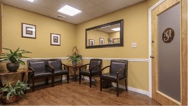 Dental office reception area with yellow walls