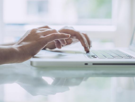 Person typing on a laptop