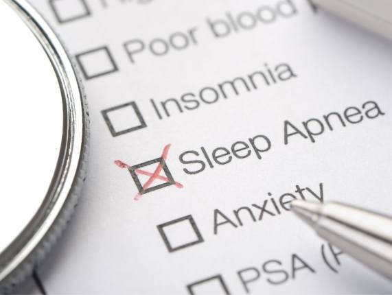 Box labeled sleep apnea checked on paper form listing medical conditions