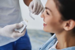 Dentist showing patient Invisalign