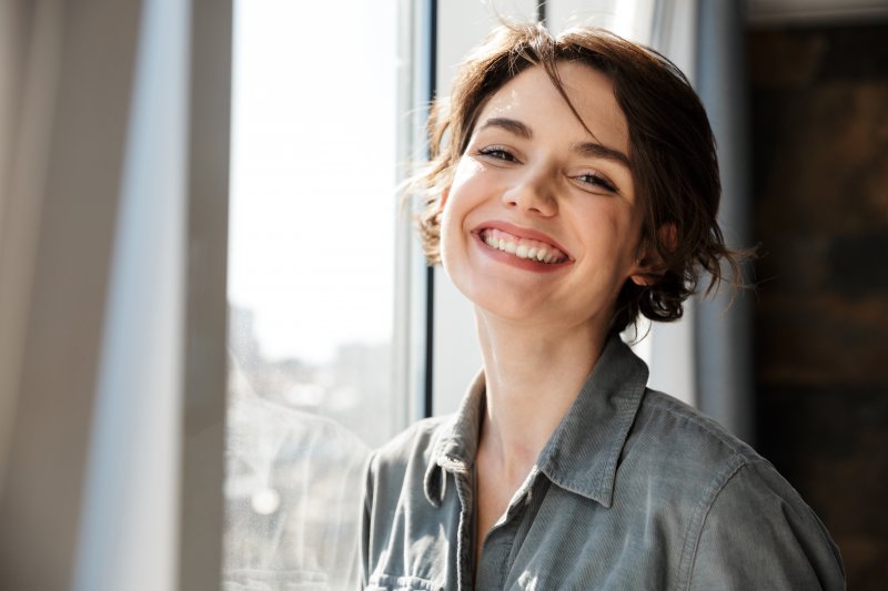 person with temporary veneers smiling