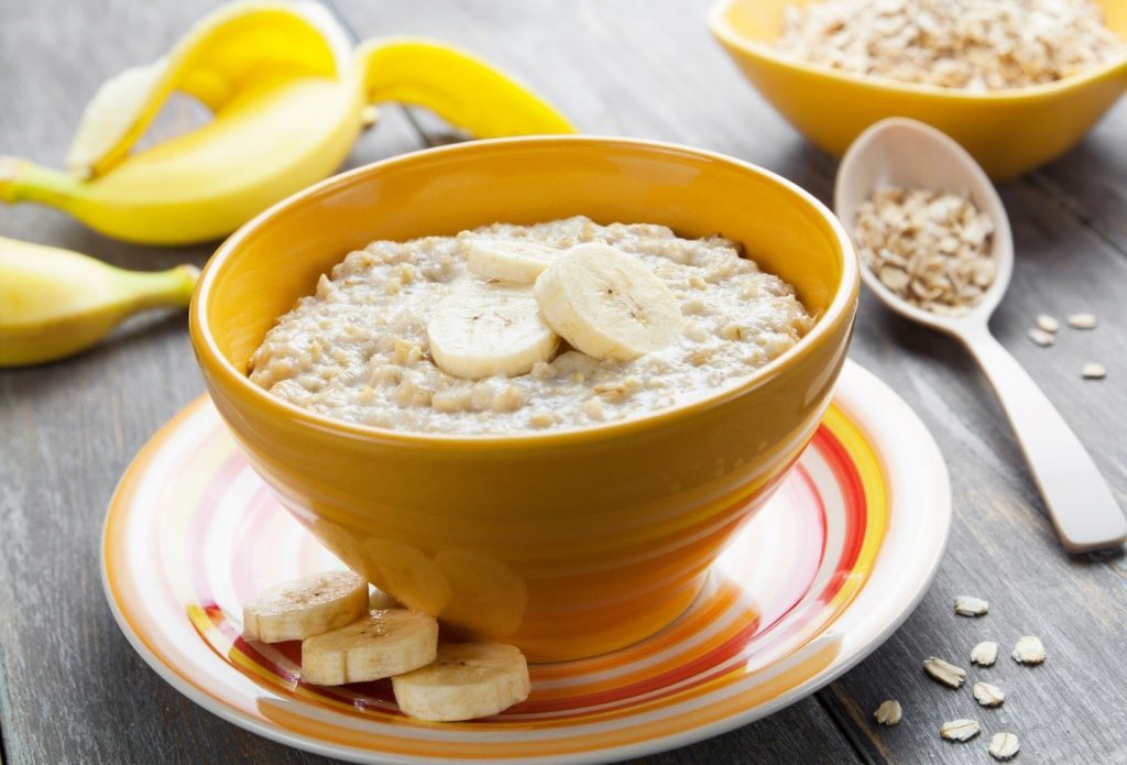 bowl of oatmeal with slices of banana